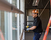 A technician repairing a garage door